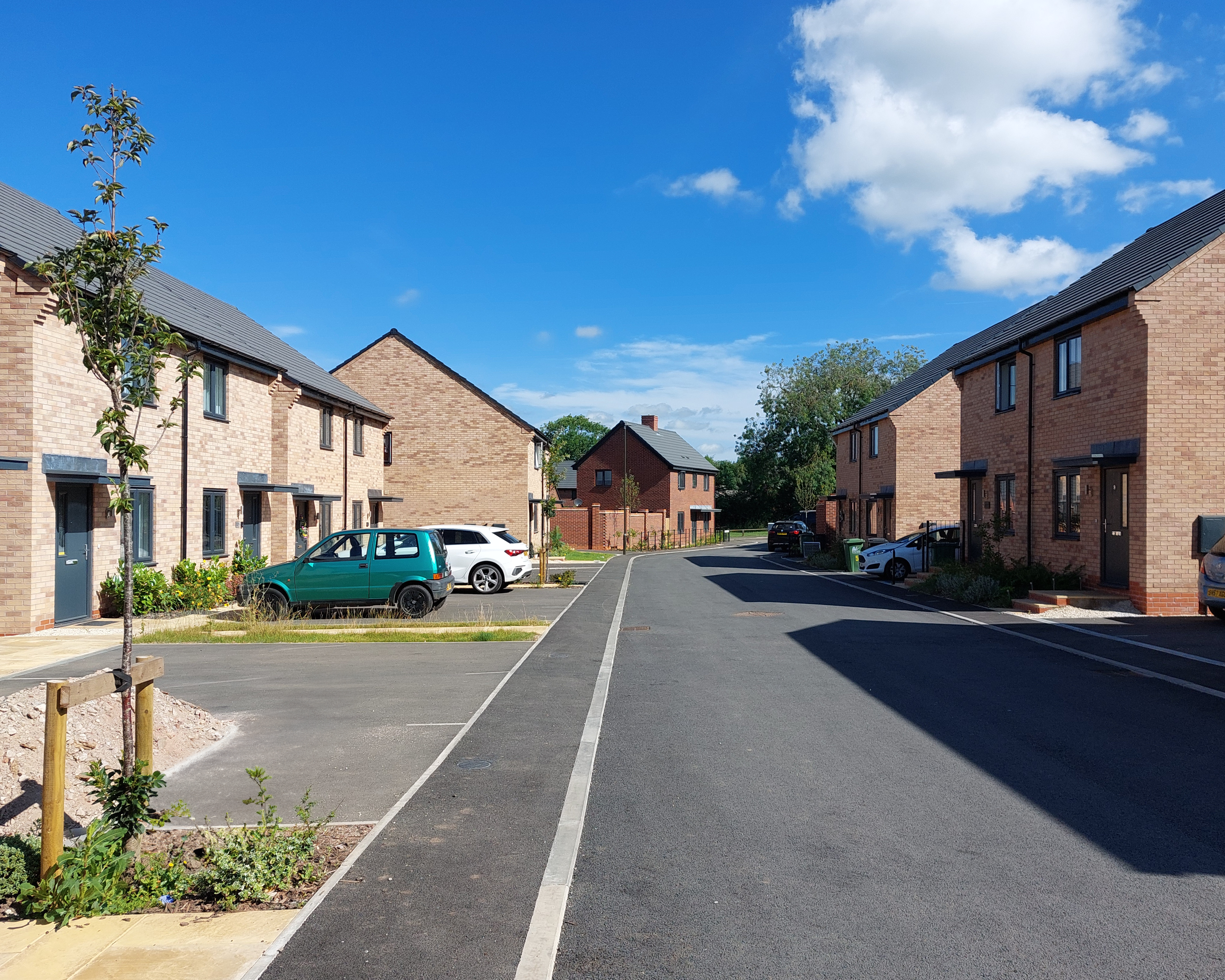 Street view of new homes at Hermitage Drive with properties to both sides