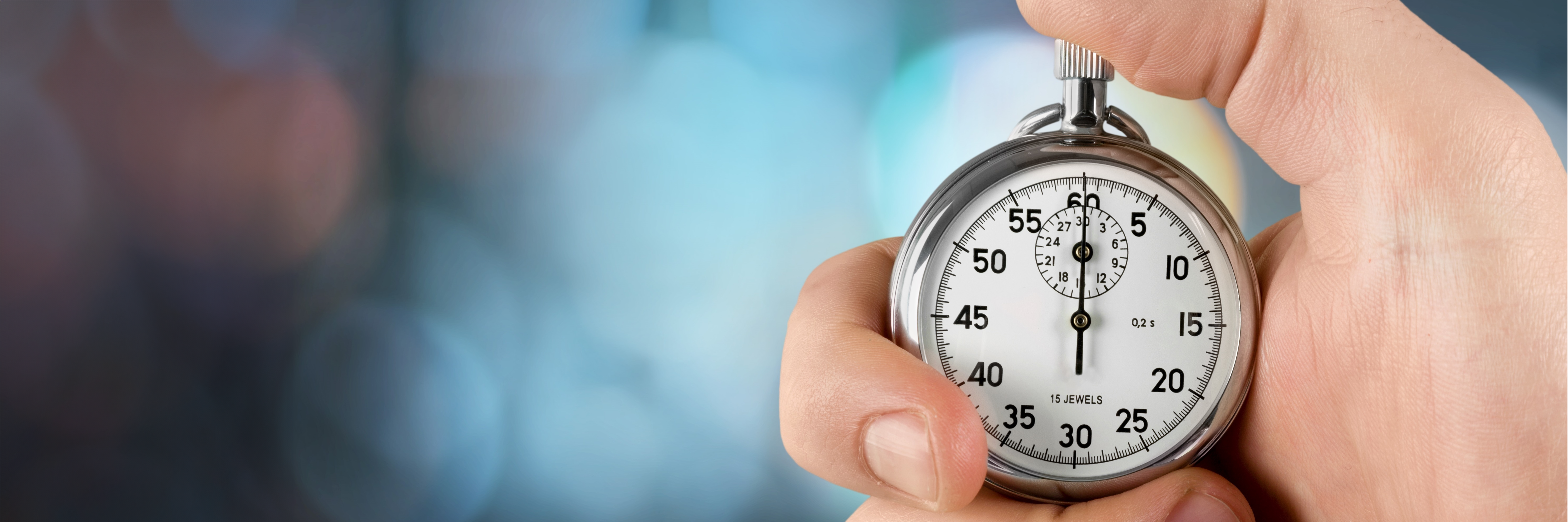 Close-up photo of a hand holding a stopwatch