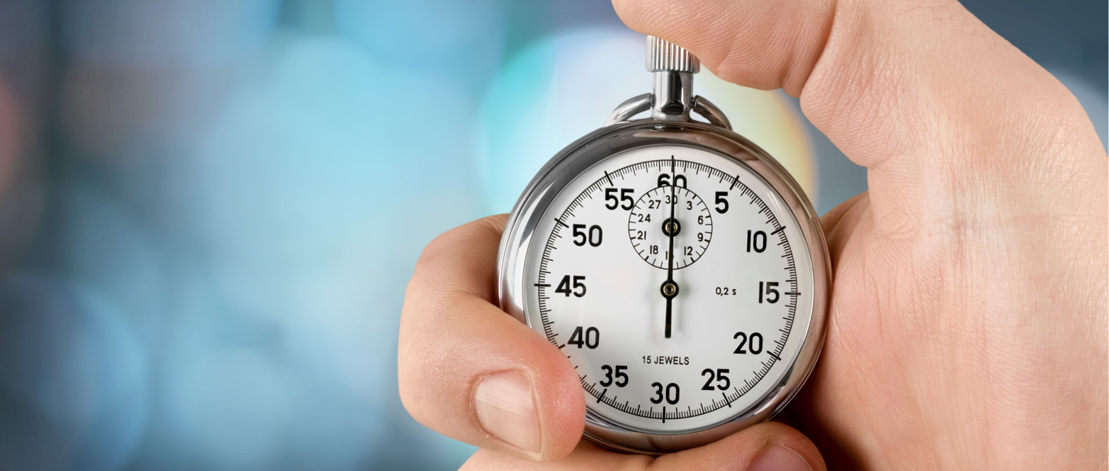 Close-up photo of a hand holding a stopwatch